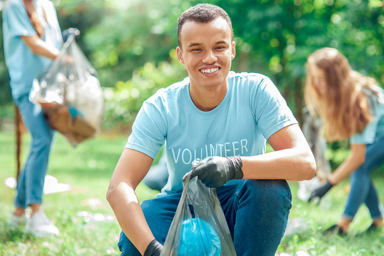 volunteer picking up trash